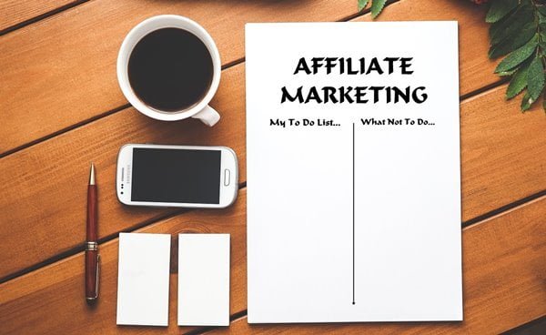 Affiliate marketing written on a paper, reminding yourself the do's and don'ts to succeed in a business with less capital